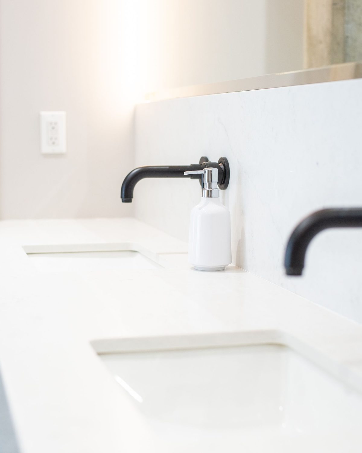 Two clean white basins set in a counter