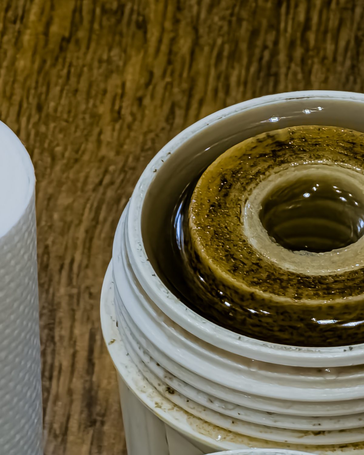 Used water filter cartridges showing trapped dirt and sediment